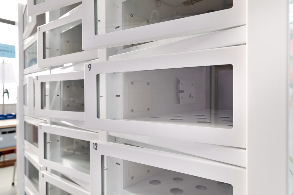 White empty vending machine, doors open during manufacturing