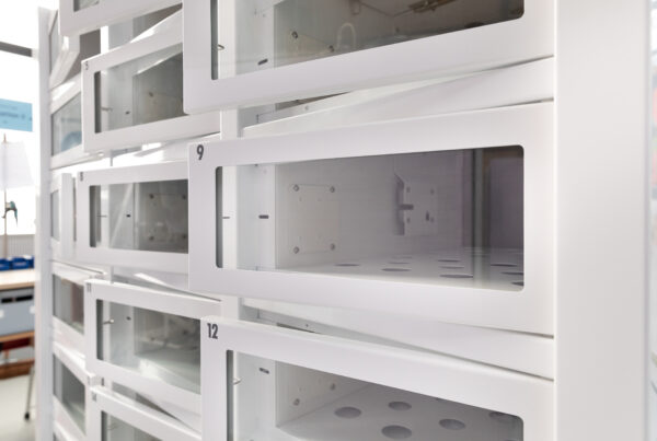 White empty vending machine, doors open during manufacturing