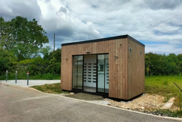 Photo of a wooden modular building at a customer’s site creating a shop space around their vending machine